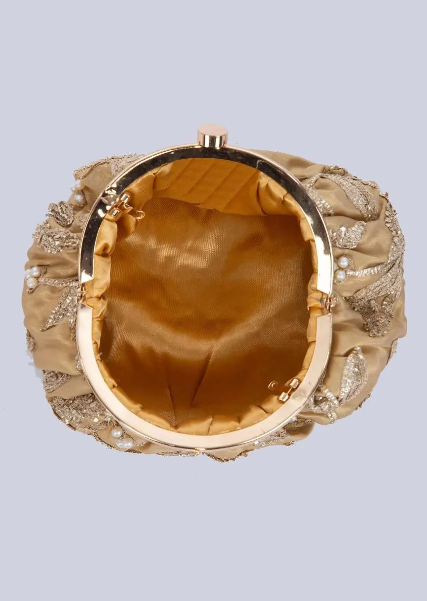 Golden clasp closure fabric clutch embellished in lace and pearl only on Kalki