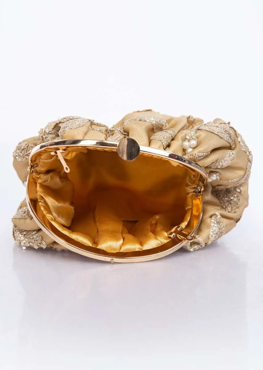 Golden clasp closure fabric clutch embellished in lace and pearl only on Kalki